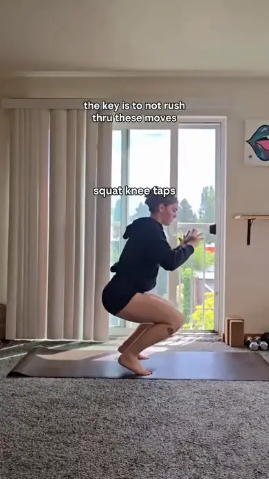 Frame from @pogawithmads’ original reel showing a squat on a mat.